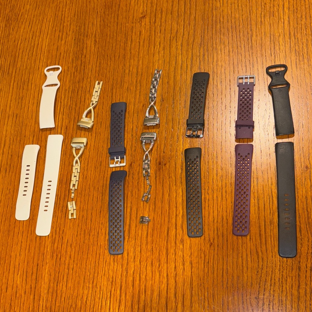 Assorted Fit Bit Watch Bands in Black, Purple, Gold, Silver, Navy, and Cream